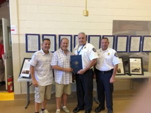 Orland Fire Protection District Board President Chris Evoy, Cook County Commissioner Sean Morrison, Fire Chief Michael Schofield, and Battalion Chief Nick Cinquepalmi.